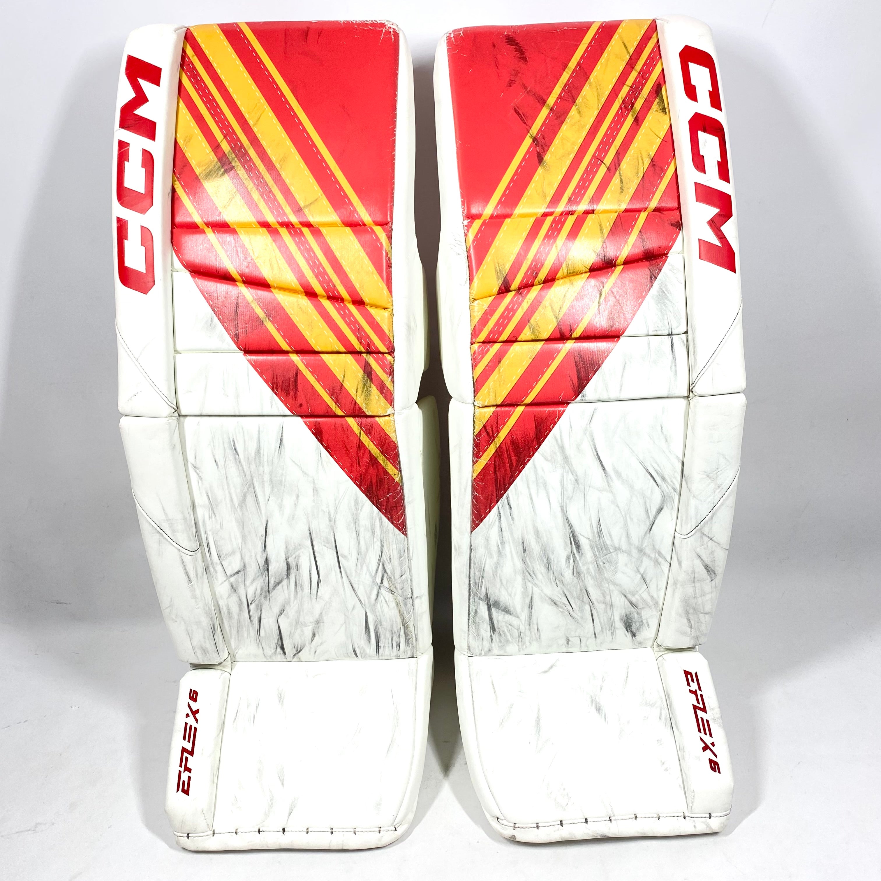 CCM Extreme Flex 6 - Jambières de gardien de but Pro Stock d'occasion (blanc/rouge/jaune)